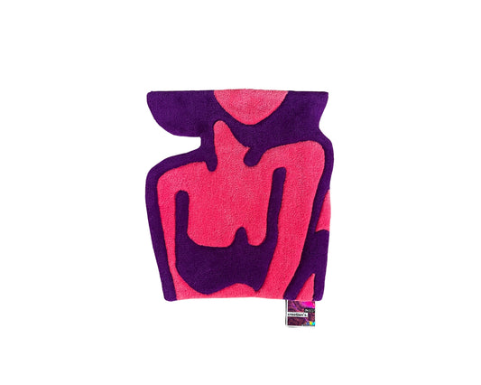 Création tuftée main aux teintes féminines.