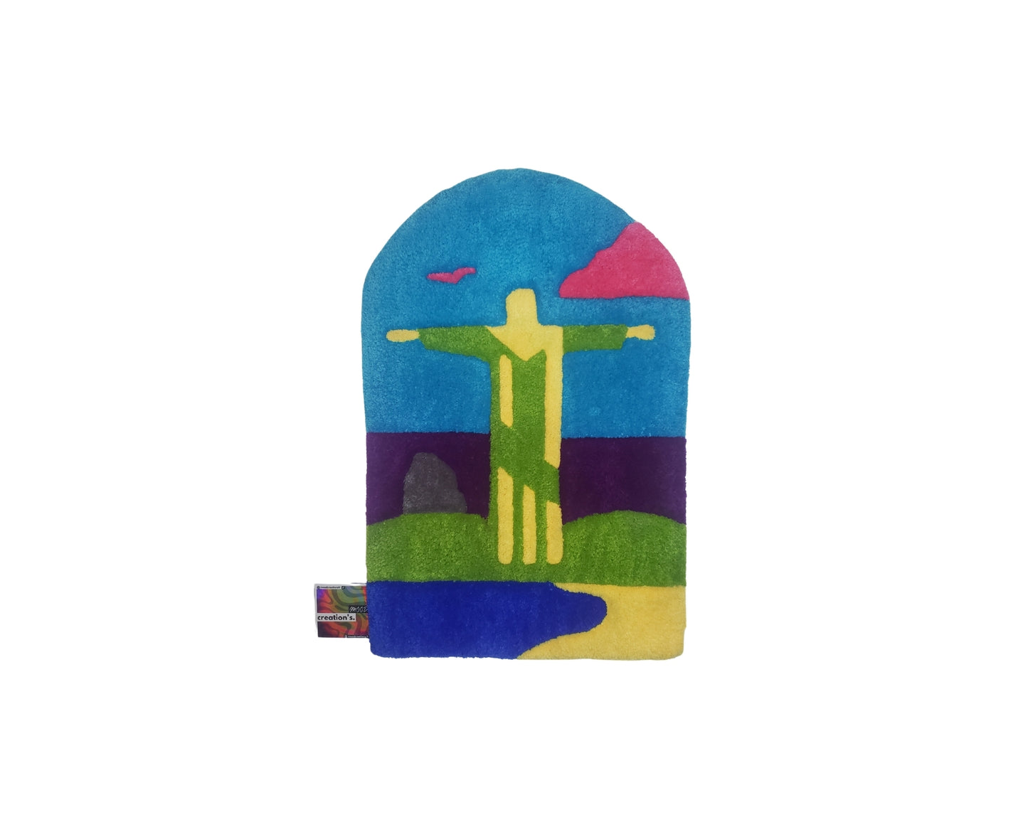 Tapis mural coloré représentant le Christ Rédempteur de Rio, tufté à la main par Mood Creations. 